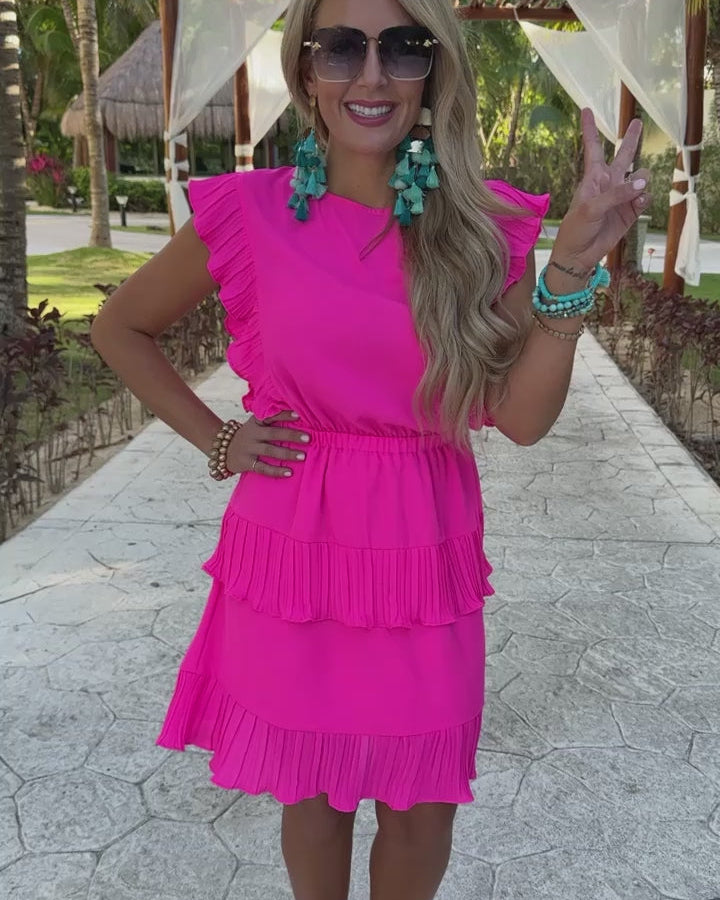 ruffled sleeve dress with layered pleats, an elastic waistband, and a lined bottom in pink