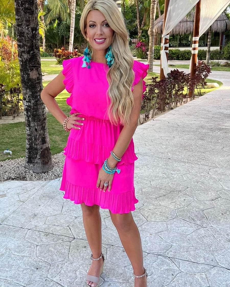 ruffled sleeve dress with layered pleats, an elastic waistband, and a lined bottom in pink