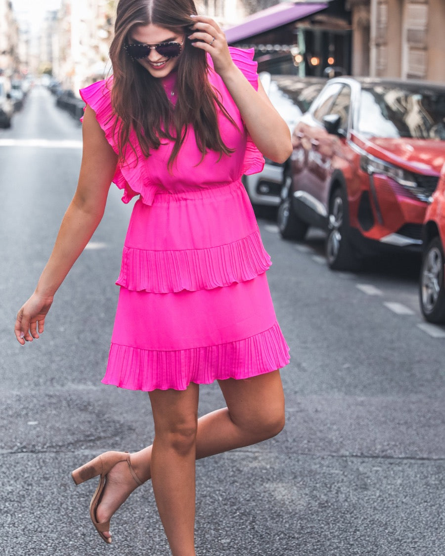 ruffled sleeve dress with layered pleats, an elastic waistband, and a lined bottom in pink