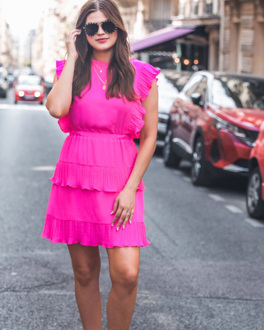 ruffled sleeve dress with layered pleats, an elastic waistband, and a lined bottom in pink