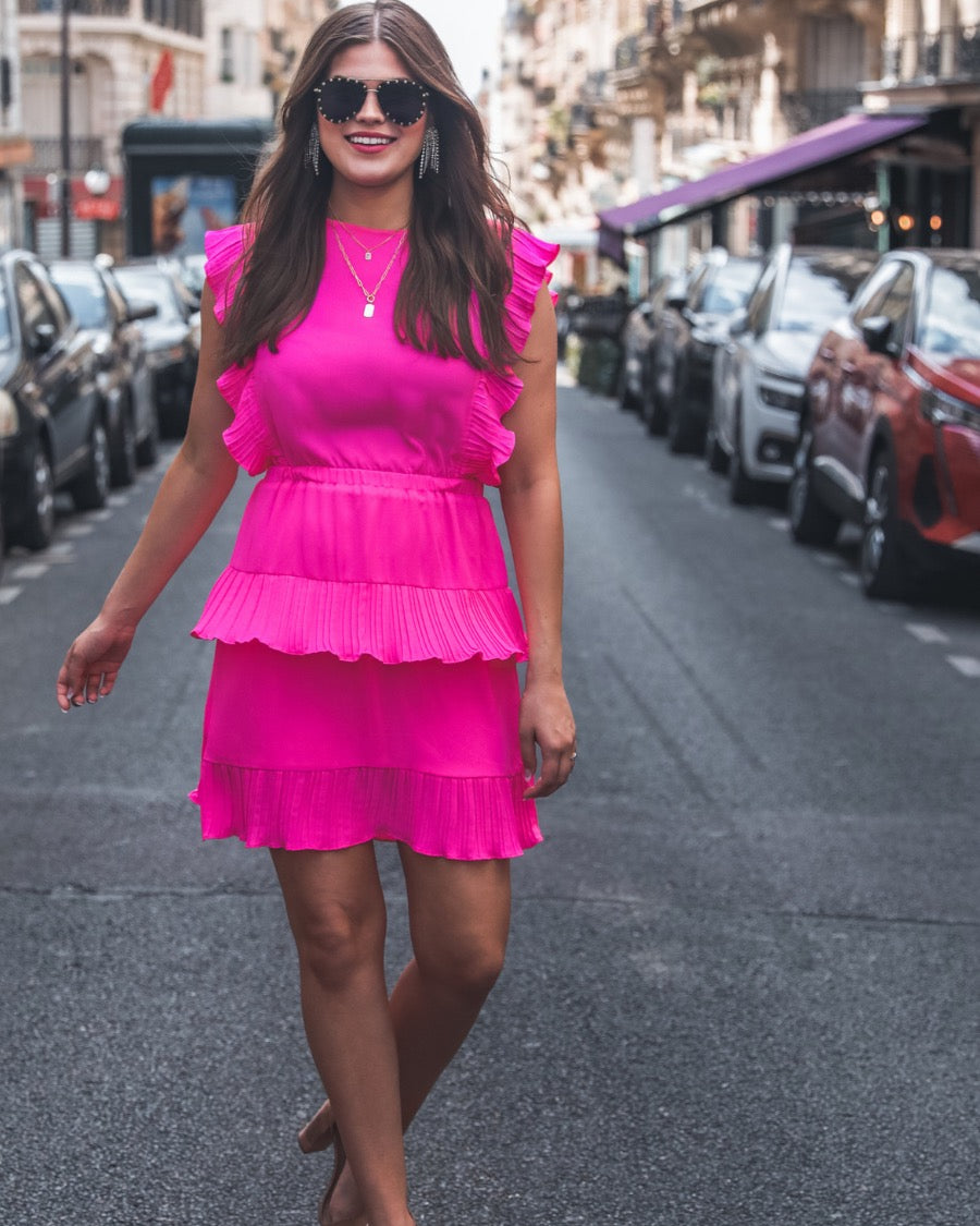 ruffled sleeve dress with layered pleats, an elastic waistband, and a lined bottom in pink