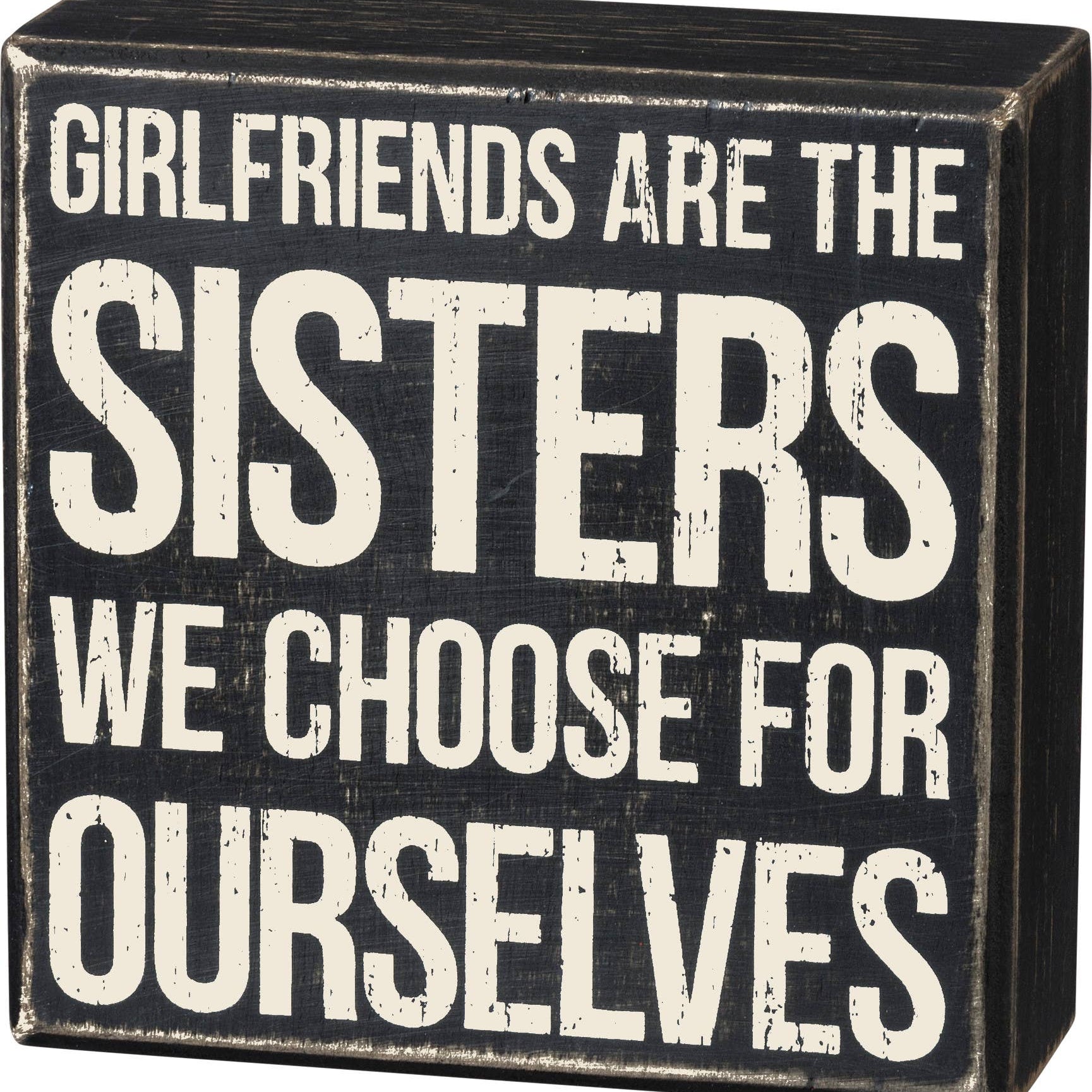 Black box sign with white text about girlfriends and sisters.