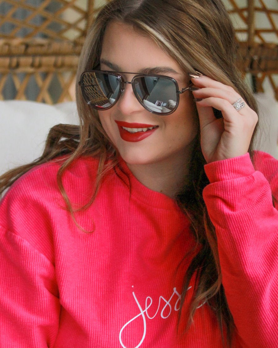 silver aviator sunglasses with thin round wireframes, tinted lenses, UV protection, and brand name detail (on both the temple and the complimentary black pouch)