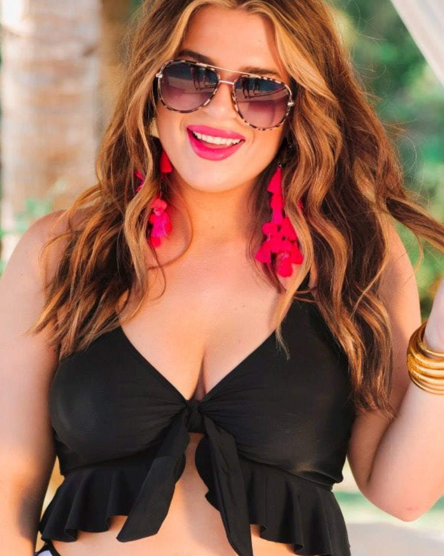 grey aviator sunglasses with thin round wireframes, tinted lenses, UV protection, and brand name detail (on both the temple and the complimentary black pouch)