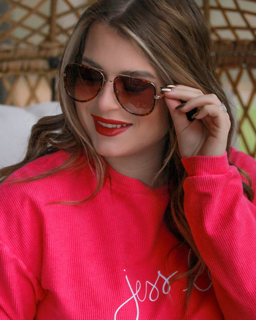 brown aviator sunglasses with thin round wireframes, tinted lenses, UV protection, and brand name detail (on both the temple and the complimentary black pouch)