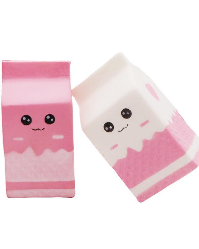 pink and white milk-carton squishies with a kawaii face, pink-and-white colorblock design, textured accent panel, side heart detail, squeezable sensory feel, and clear individual packaging