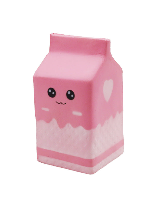 a pink milk-carton squishy with a kawaii face, pink-and-white colorblock design, textured accent panel, side heart detail, squeezable sensory feel, and clear individual packaging