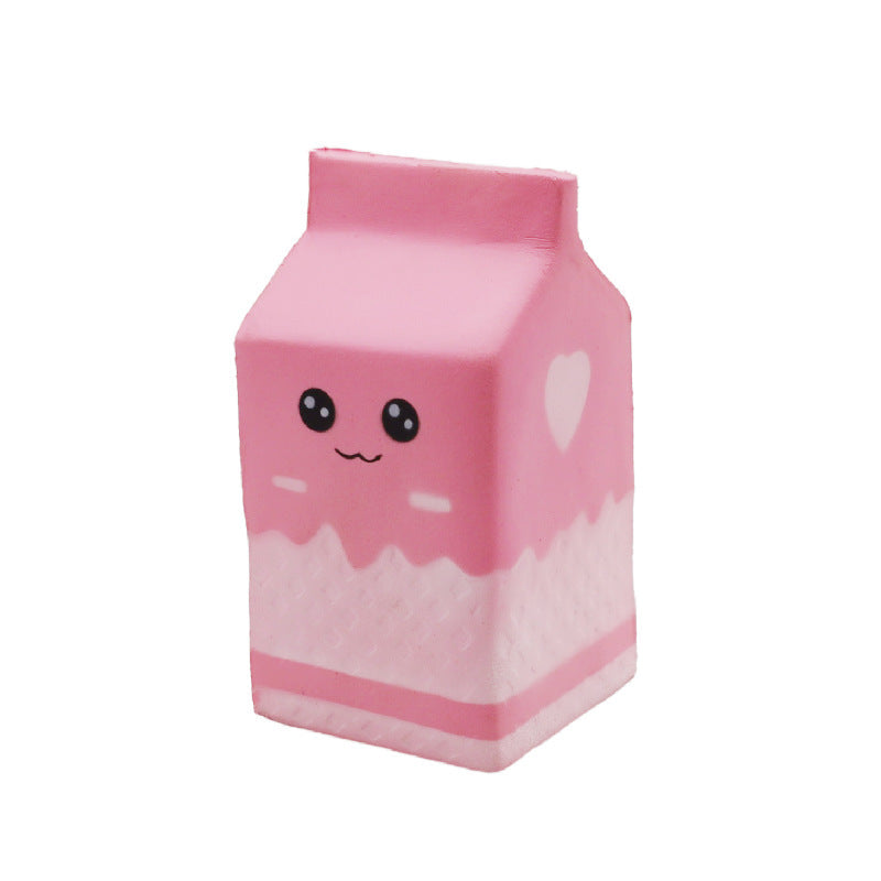 a pink milk-carton squishy with a kawaii face, pink-and-white colorblock design, textured accent panel, side heart detail, squeezable sensory feel, and clear individual packaging