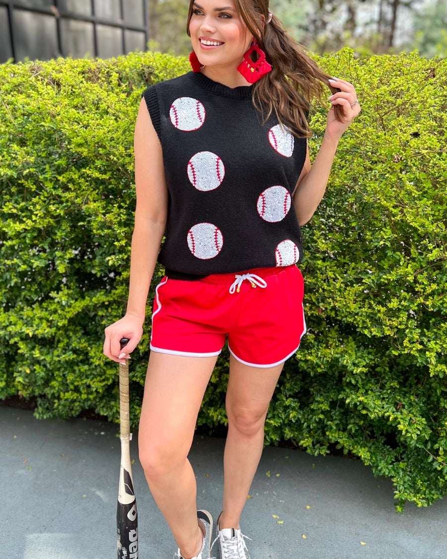 a black sleeveless sweater vest with an oversized fit, an allover textured baseball motif, and ribbed trim at the neckline, arm openings, and hem