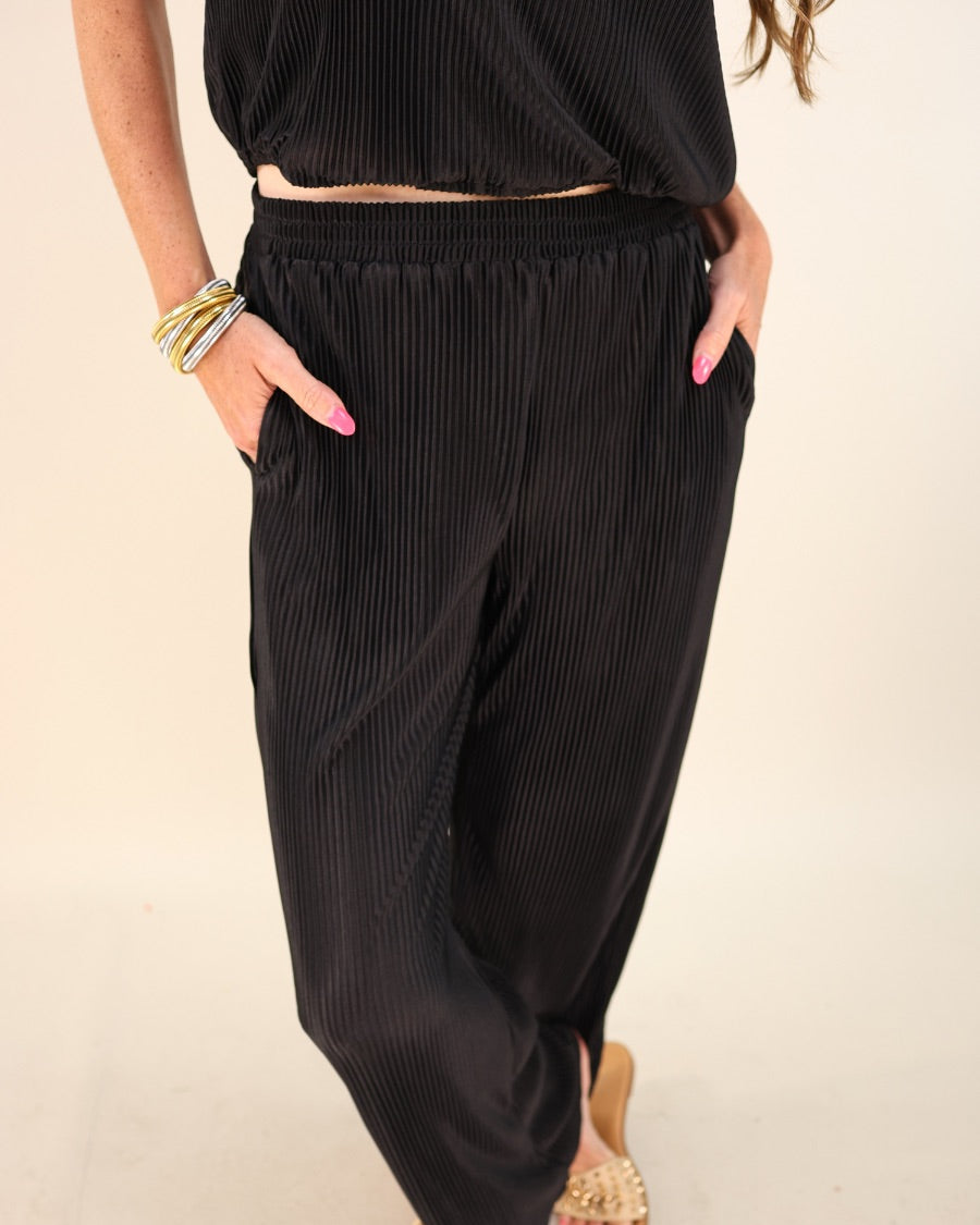 black pleated two-piece elastic button keyhole back top and elastic waistband bottoms with flowy legs and pockets