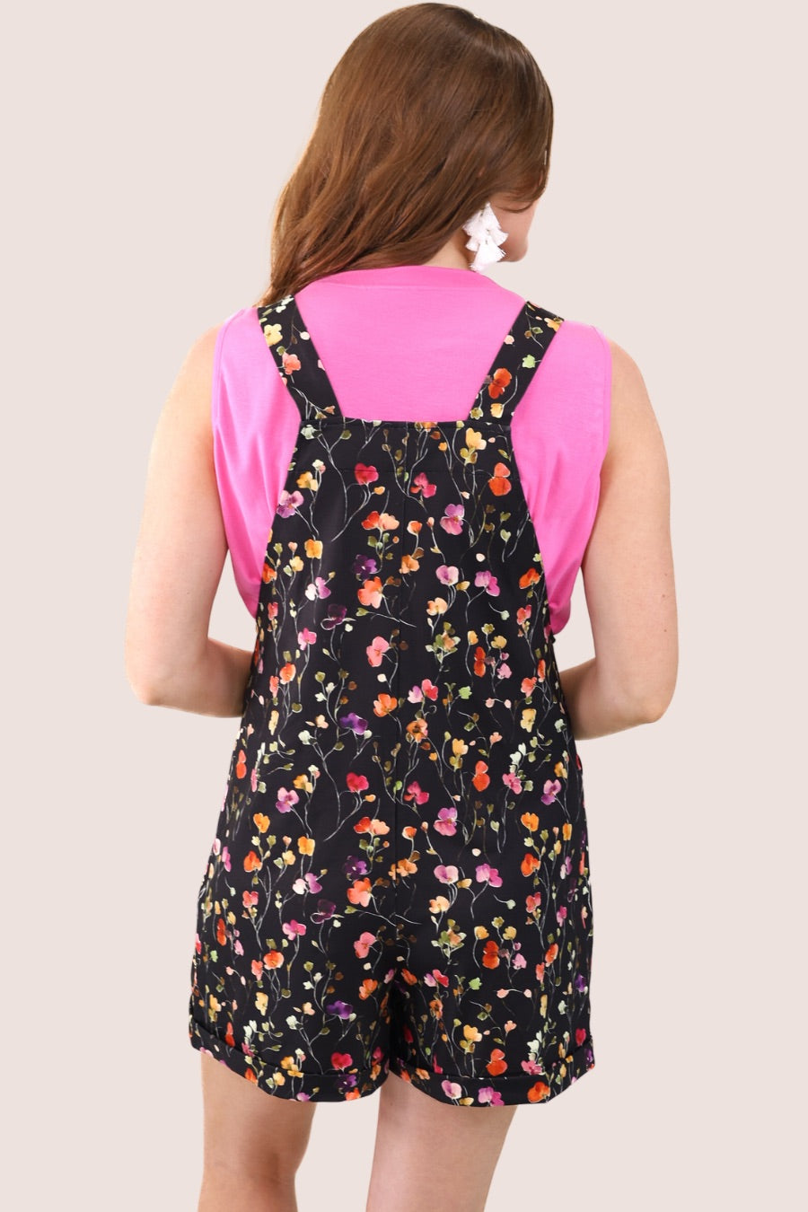 multicolor floral pattern print overall shorts on a black base made from our best-selling everyday fabric with functional button straps, a bib-style front, cuffed hems, roomy side pockets, and a relaxed silhouette