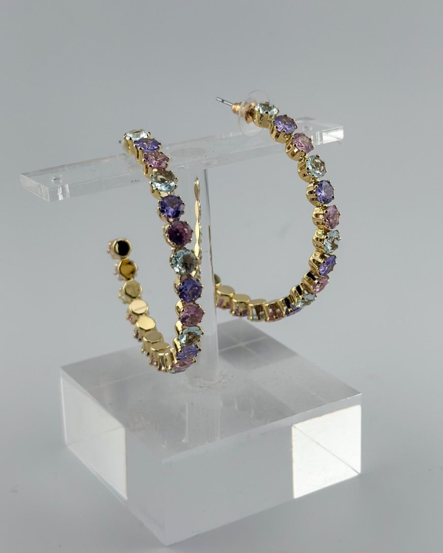 gold post-stud hoops adorned with colorful gems and a comfort earring back in gold