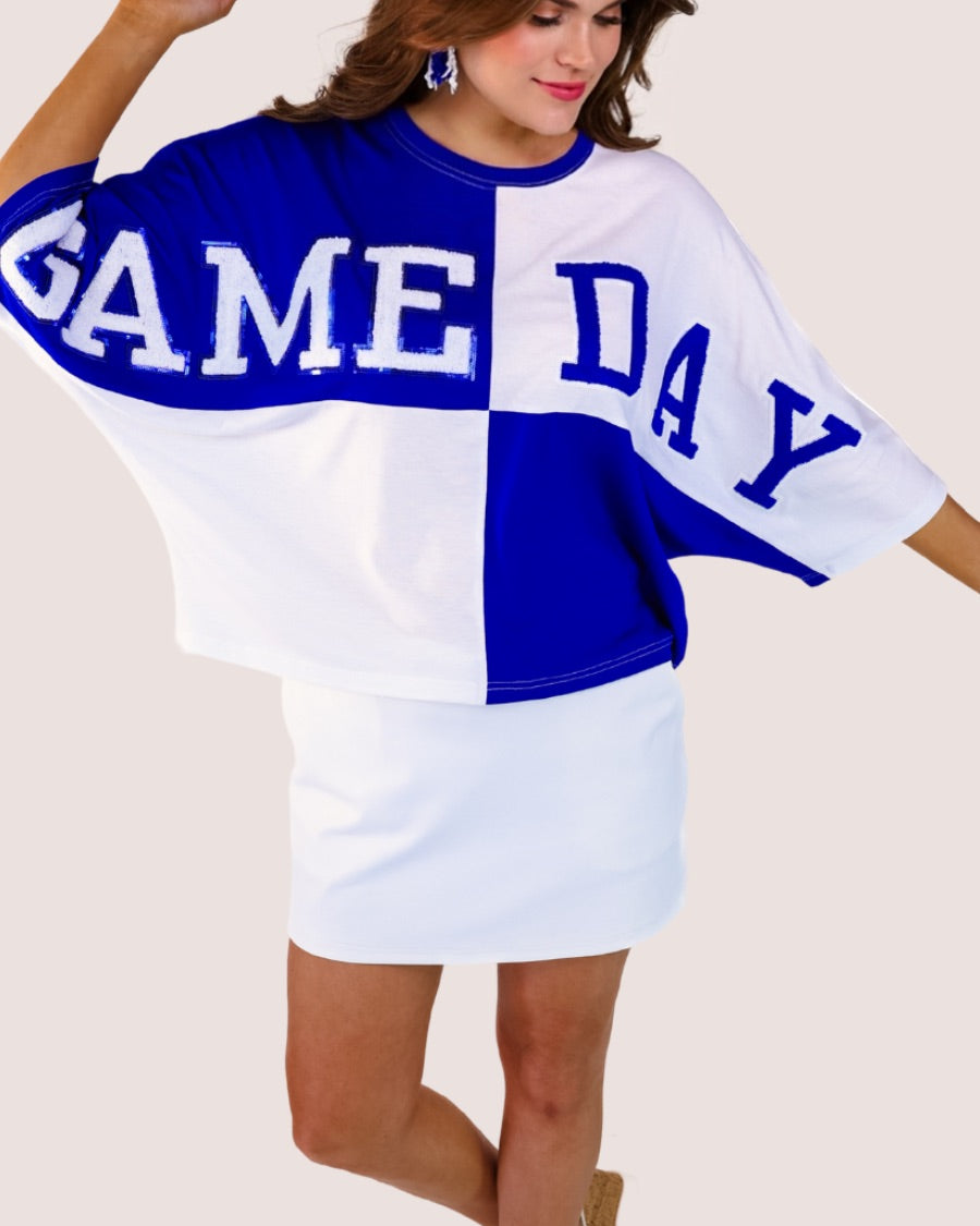 short-sleeve color block mom crop top with oversized chenille 'GAME DAY' lettering outlined in sequins, where GAME pops with a coordinating color outline to match the color block style, while DAY stands out with a crisp white outline in blue