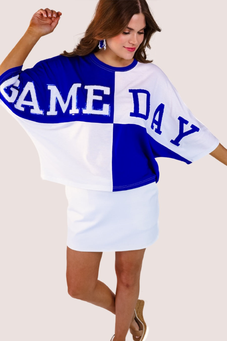 short-sleeve color block mom crop top with oversized chenille 'GAME DAY' lettering outlined in sequins, where GAME pops with a coordinating color outline to match the color block style, while DAY stands out with a crisp white outline in blue