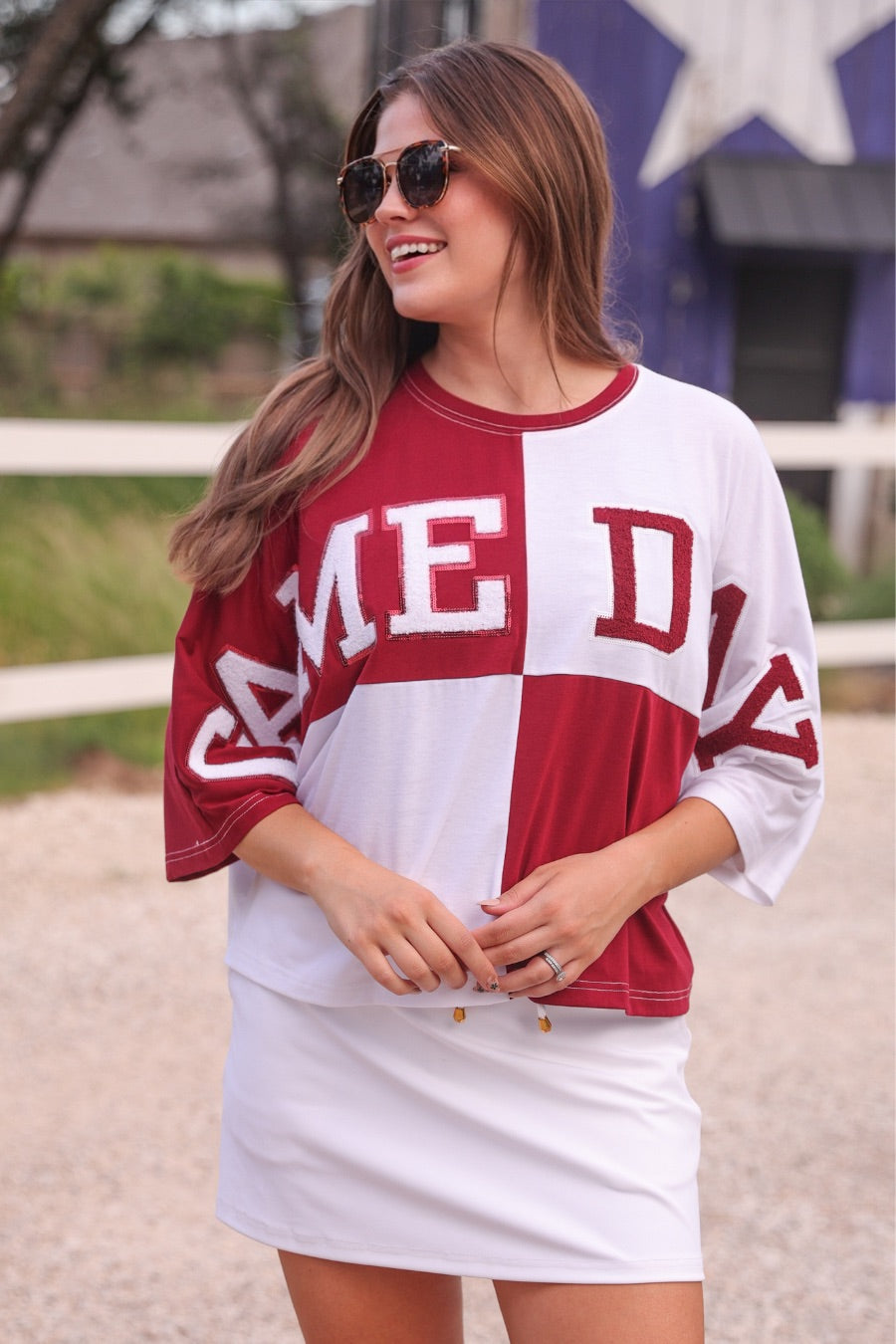 short-sleeve color block mom crop top with oversized chenille 'GAME DAY' lettering outlined in sequins, where GAME pops with a coordinating color outline to match the color block style, while DAY stands out with a crisp white outline in maroon