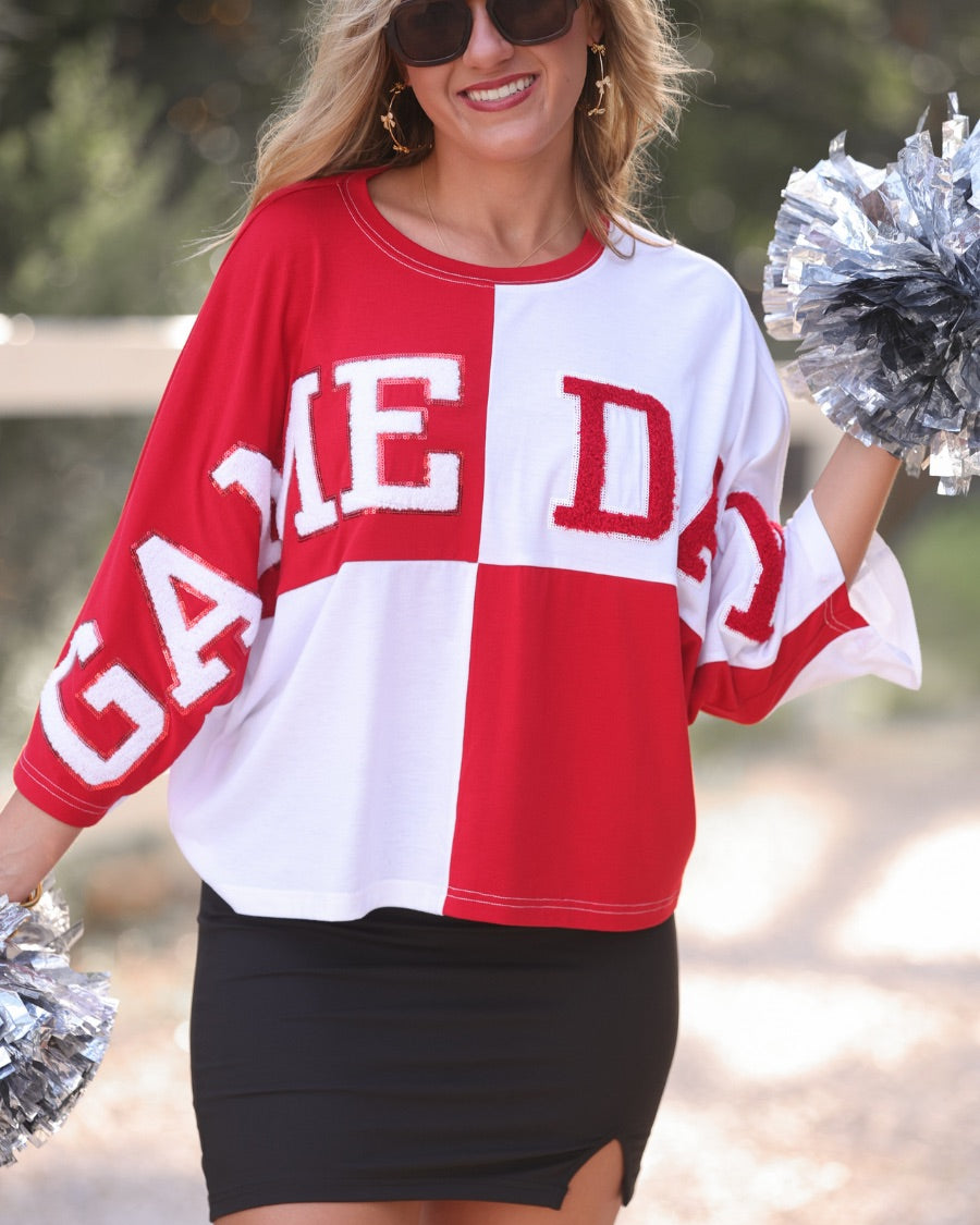 short-sleeve color block mom crop top with oversized chenille 'GAME DAY' lettering outlined in sequins, where GAME pops with a coordinating color outline to match the color block style, while DAY stands out with a crisp white outline in red