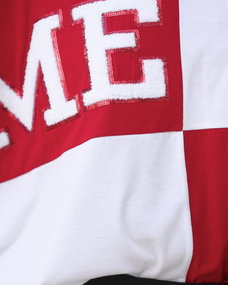 short-sleeve color block mom crop top with oversized chenille 'GAME DAY' lettering outlined in sequins, where GAME pops with a coordinating color outline to match the color block style, while DAY stands out with a crisp white outline in red