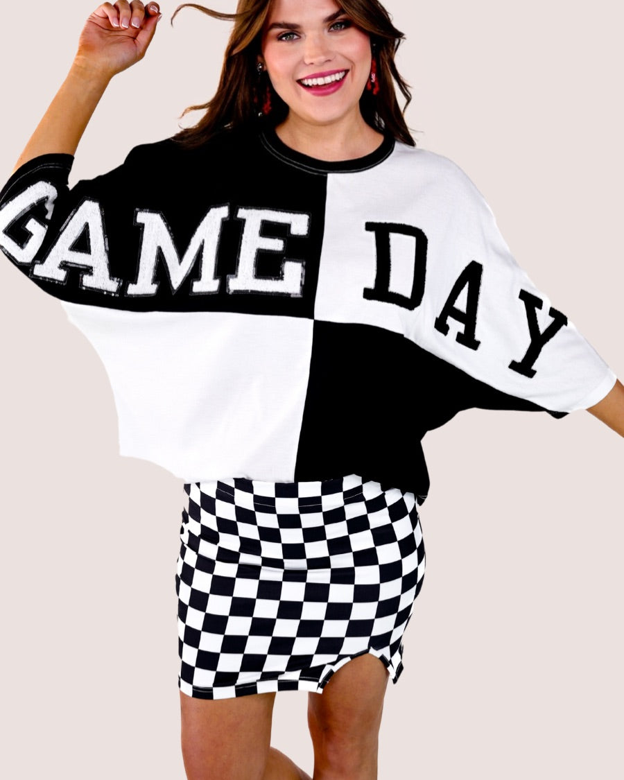 short-sleeve color block mom crop top with oversized chenille 'GAME DAY' lettering outlined in sequins, where GAME pops with a coordinating color outline to match the color block style, while DAY stands out with a crisp white outline in black