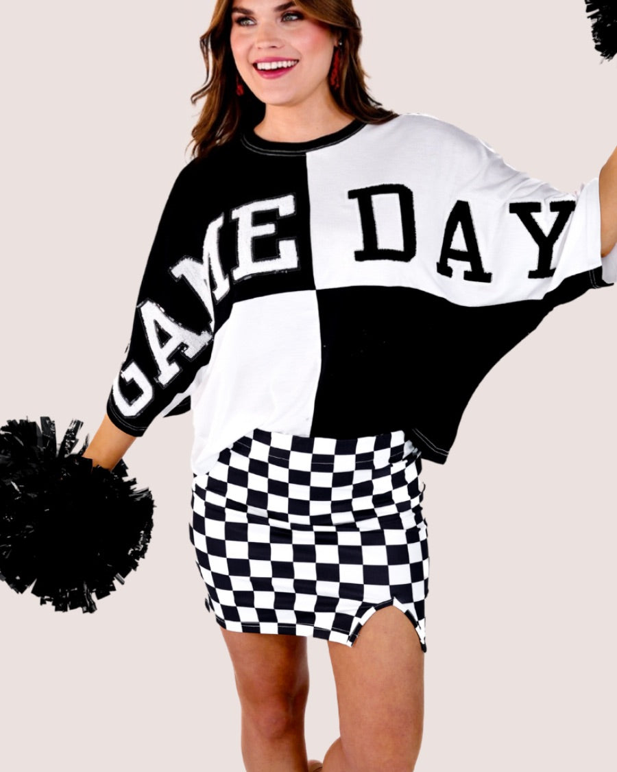 short-sleeve color block mom crop top with oversized chenille 'GAME DAY' lettering outlined in sequins, where GAME pops with a coordinating color outline to match the color block style, while DAY stands out with a crisp white outline in black
