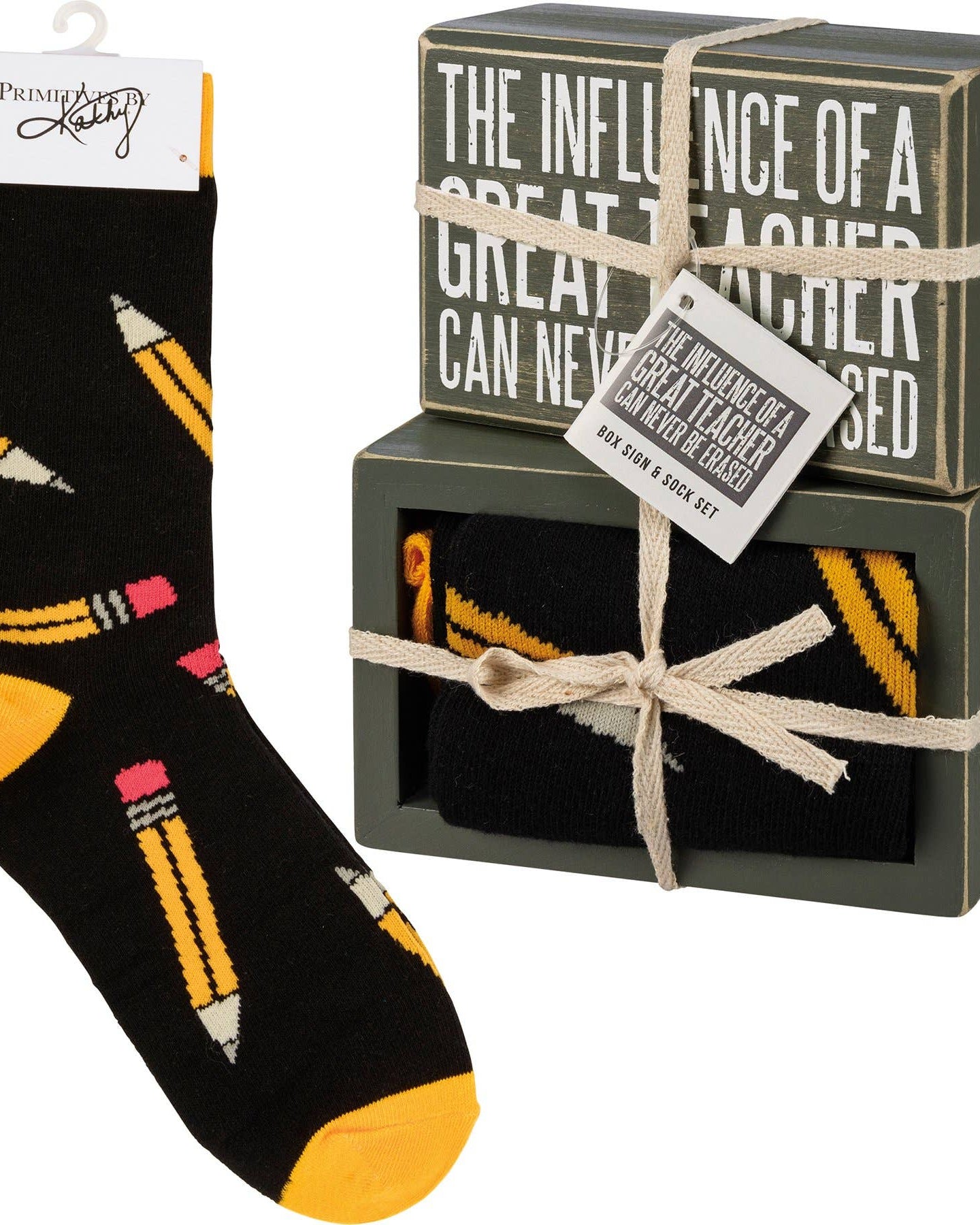 Black socks with yellow and pink accents and a decorative box with text.
