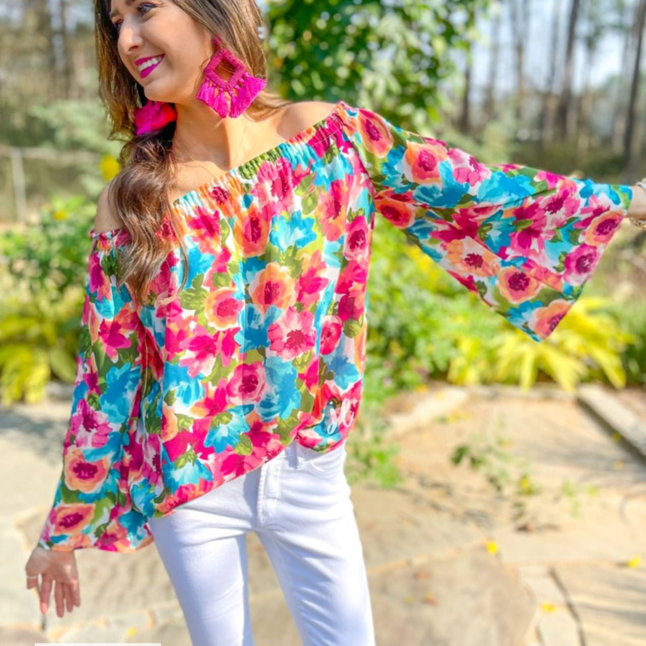 made in USA off-the-shoulder flow top with an elastic neckline in a vibrant exclusive floral pattern in multicolor
