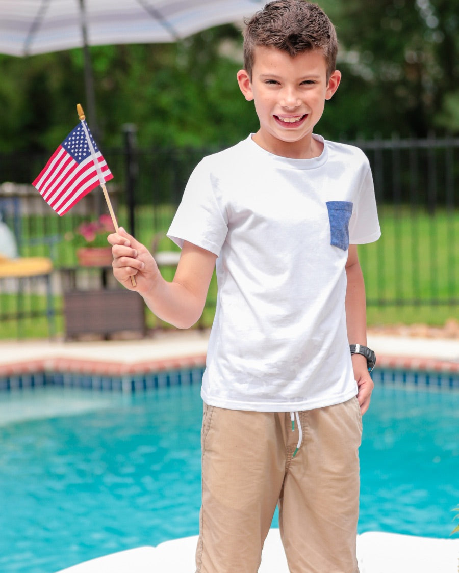 white short sleeve tee with blue star pattern print on pocket and round neckline