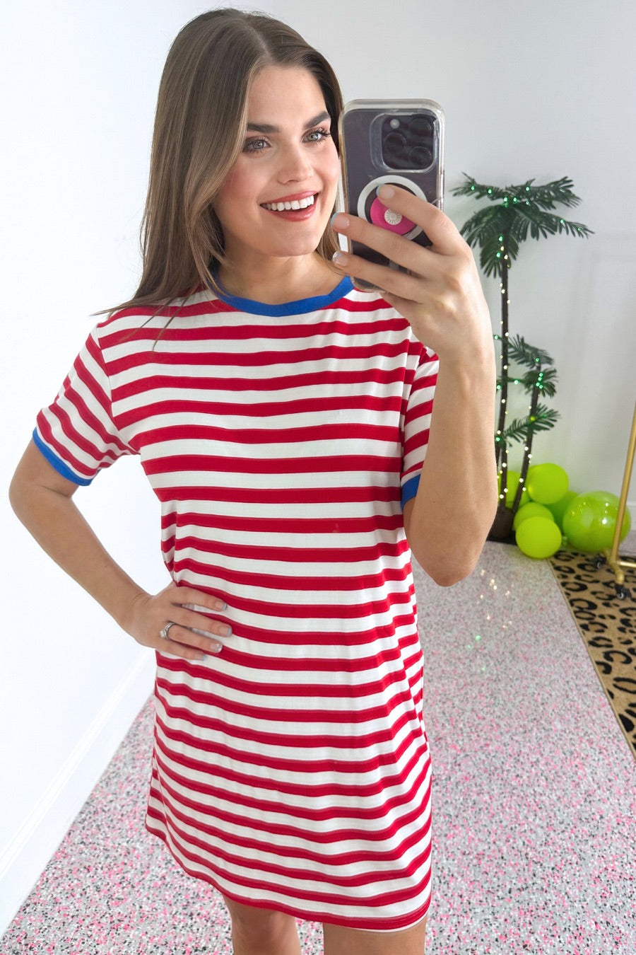 short-sleeve dress, crafted from ultra-soft fabric in a solid white color with horizontal red stripes, a blue collar, and cuffed sleeves