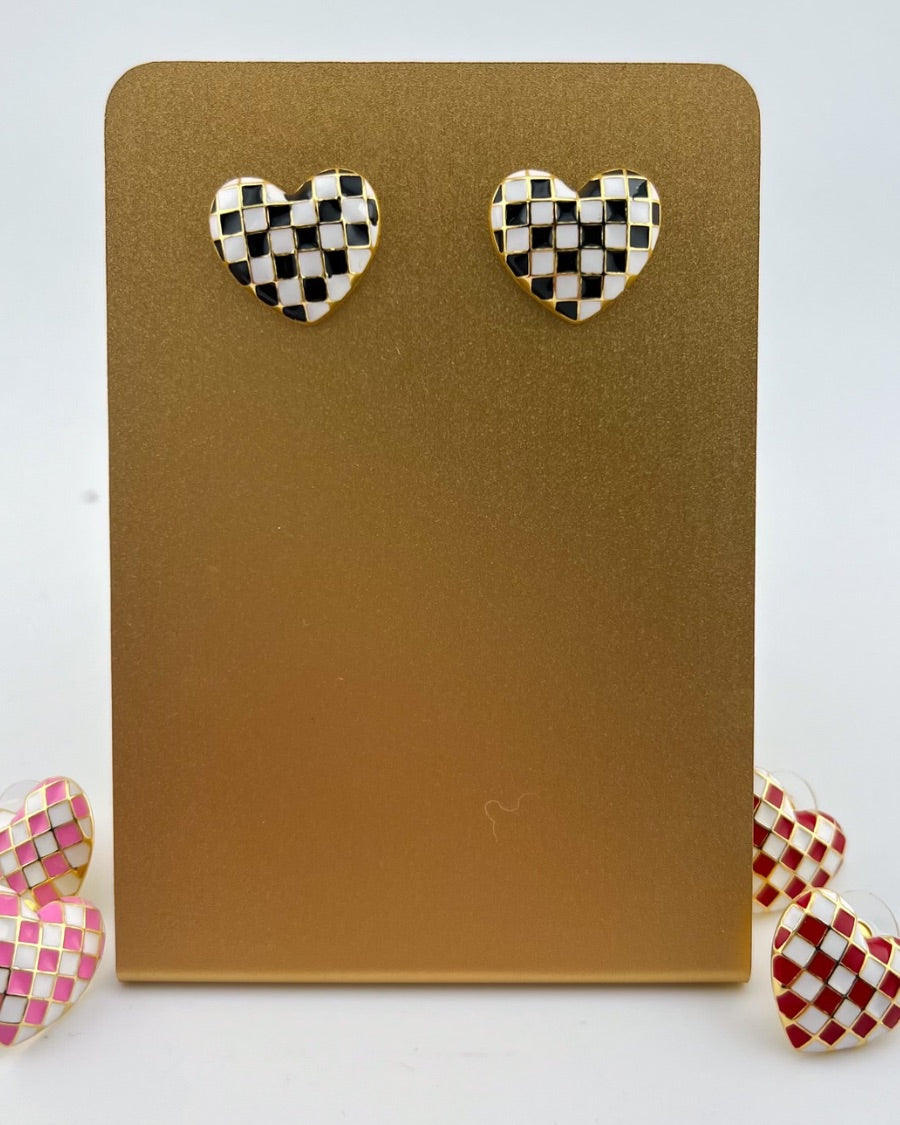 vibrant black heart-shaped stud with a comfort earring back in gold