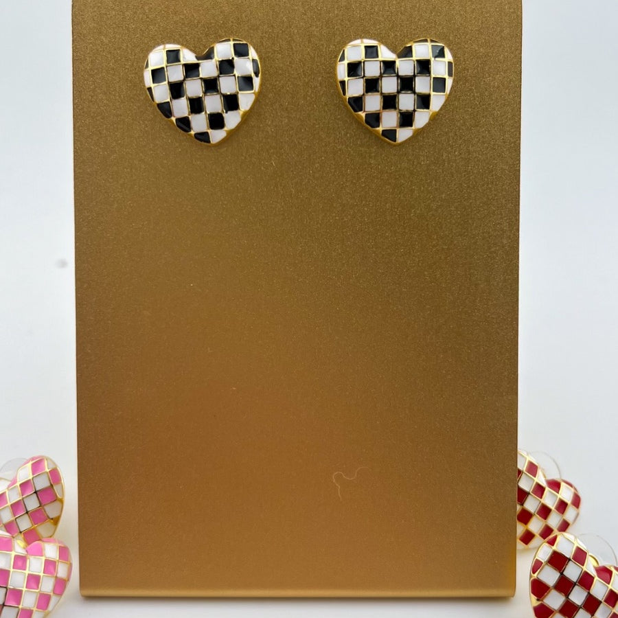 vibrant black heart-shaped stud with a comfort earring back in gold