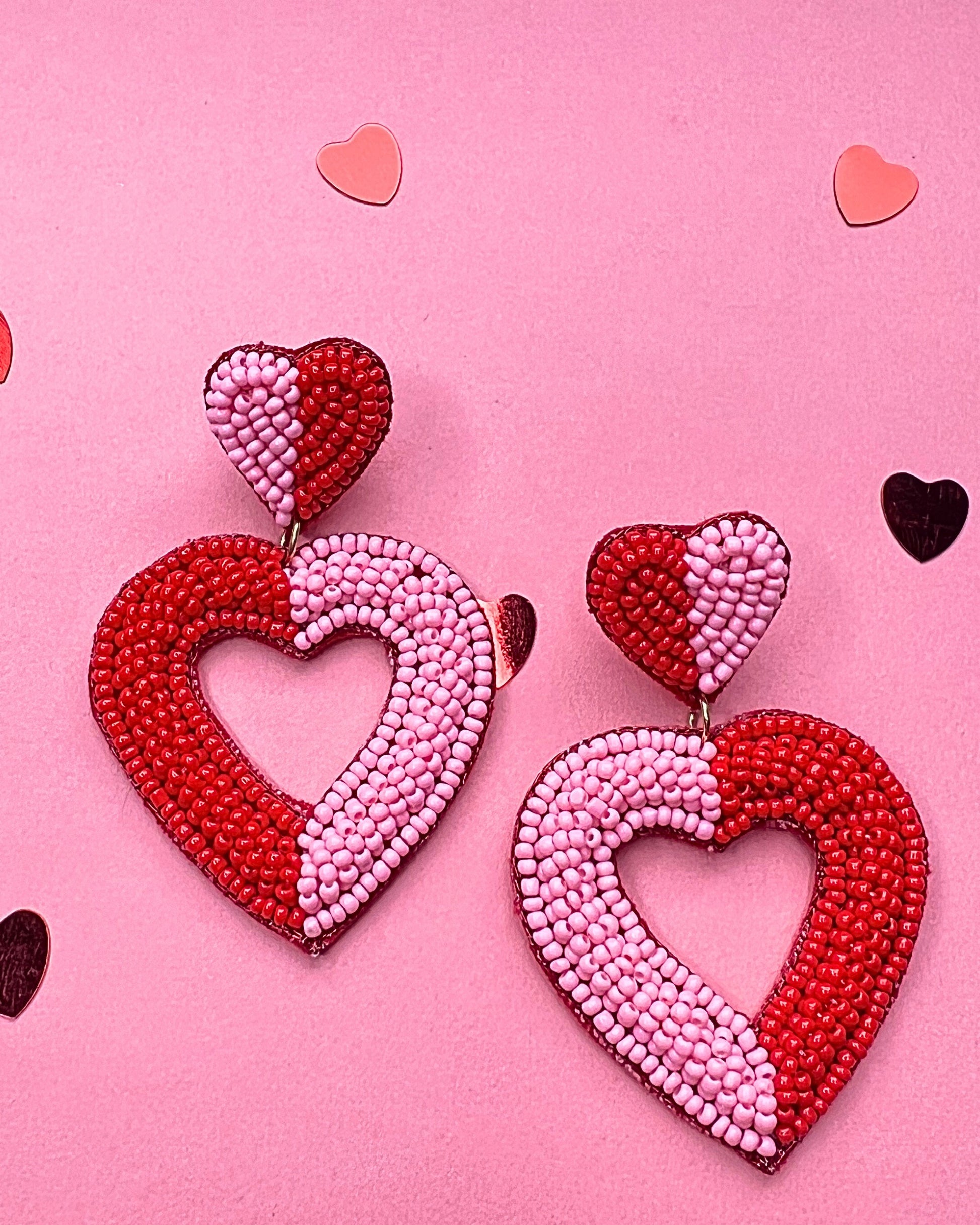 two-toned mirrored heart-shaped dangle earrings with a comfort back and a plastic disc stopper in gold