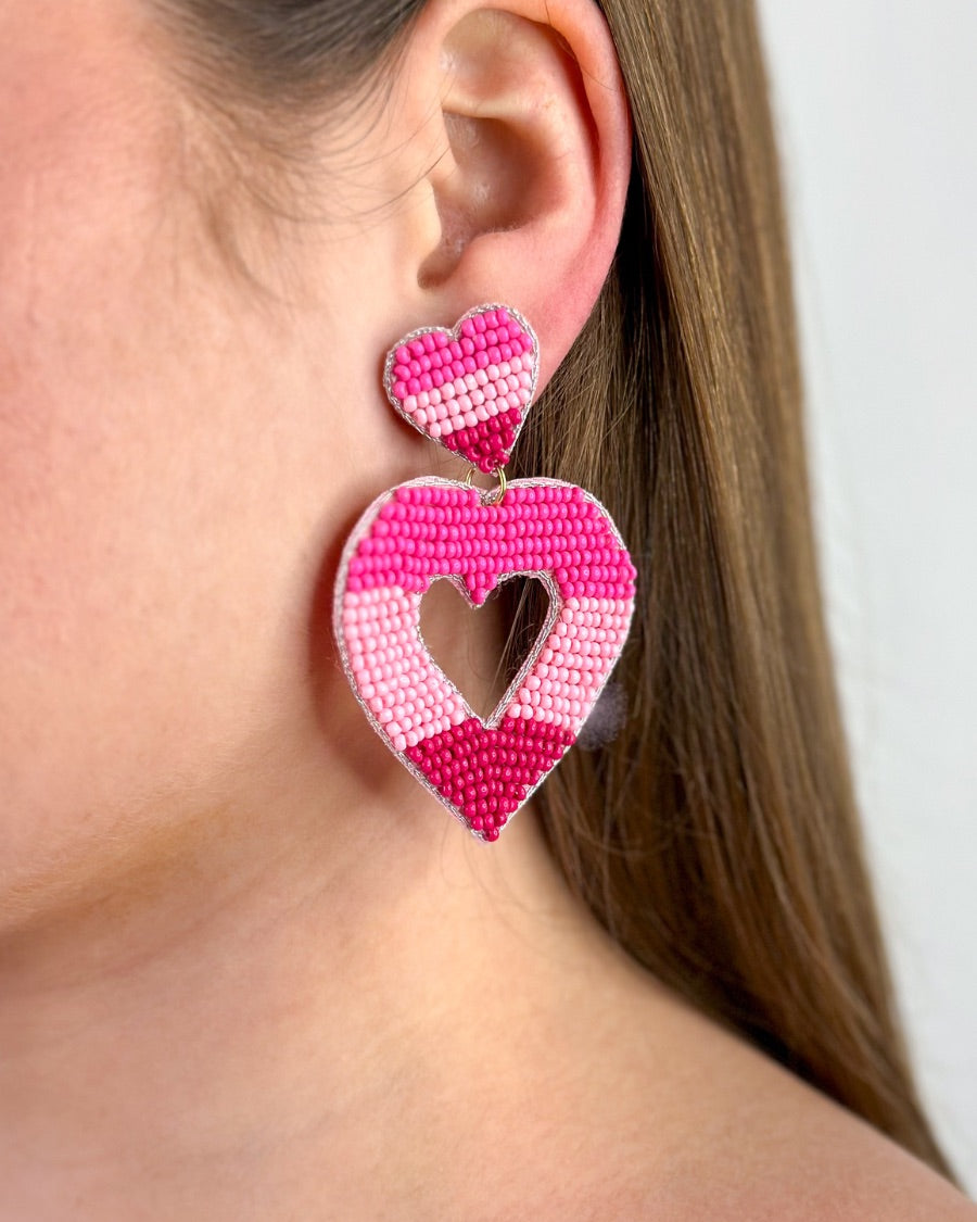 pink ombré horizontal stripe dangle earrings with a comfort back with a plastic disc stopper in gold