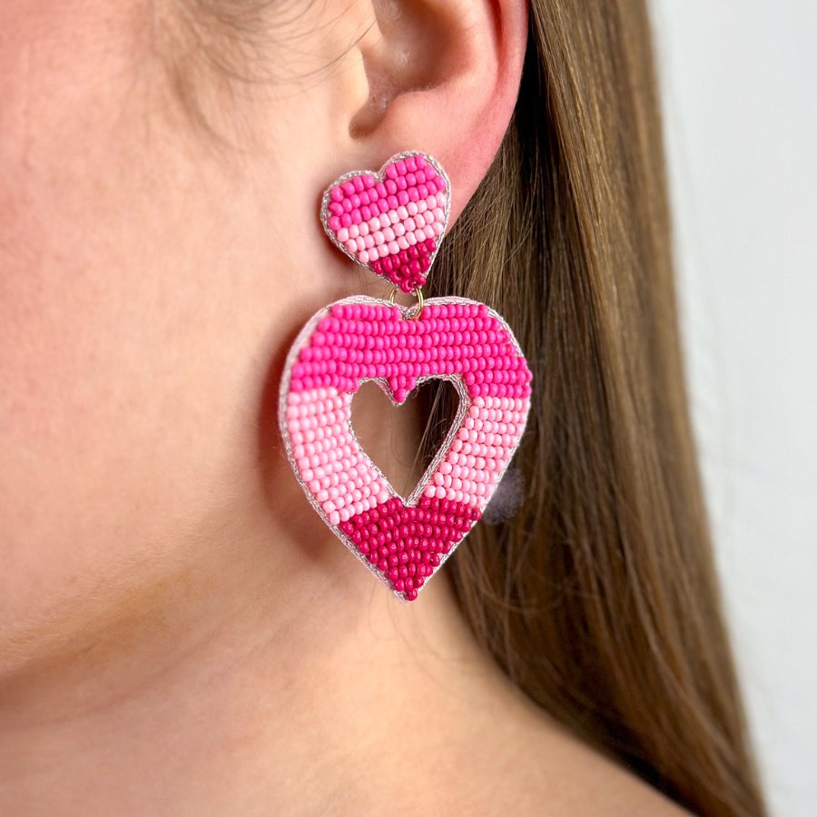 pink ombré horizontal stripe dangle earrings with a comfort back with a plastic disc stopper in gold