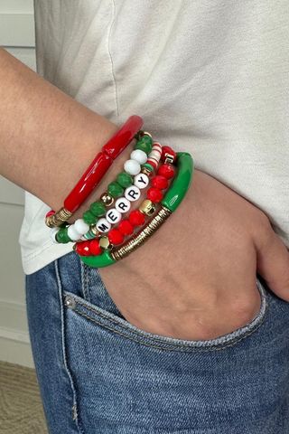5-piece holiday bracelet set with acrylic beads, disks, thin tubes, and lettering