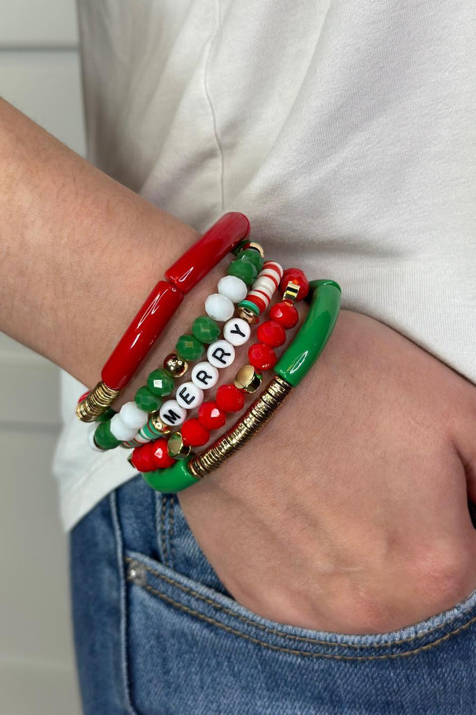 5-piece holiday bracelet set with acrylic beads, disks, thin tubes, and lettering