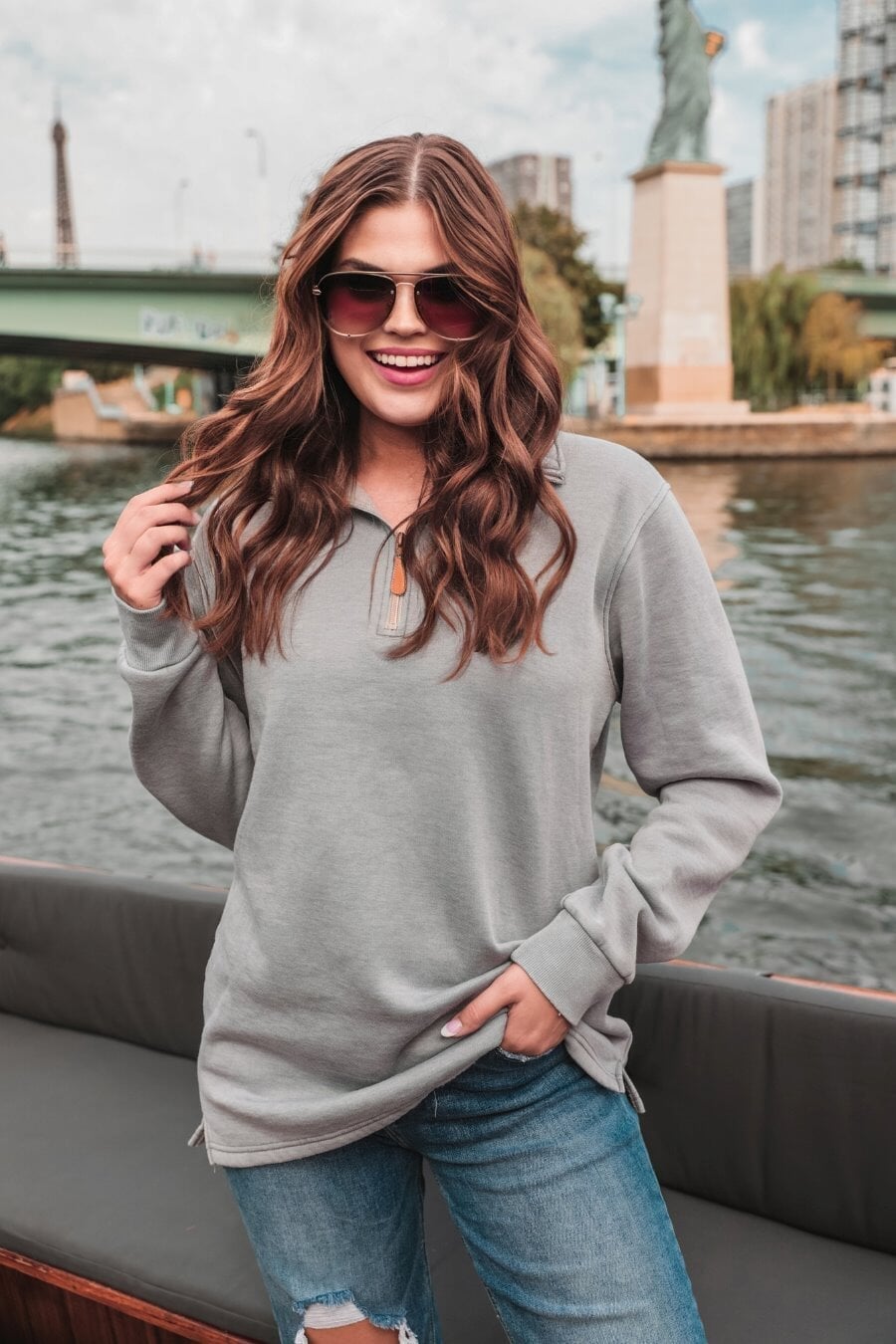 long sleeve pullover crafted from vintage wash fabric with a foldable collar, side slits, and a quarter zip in grey