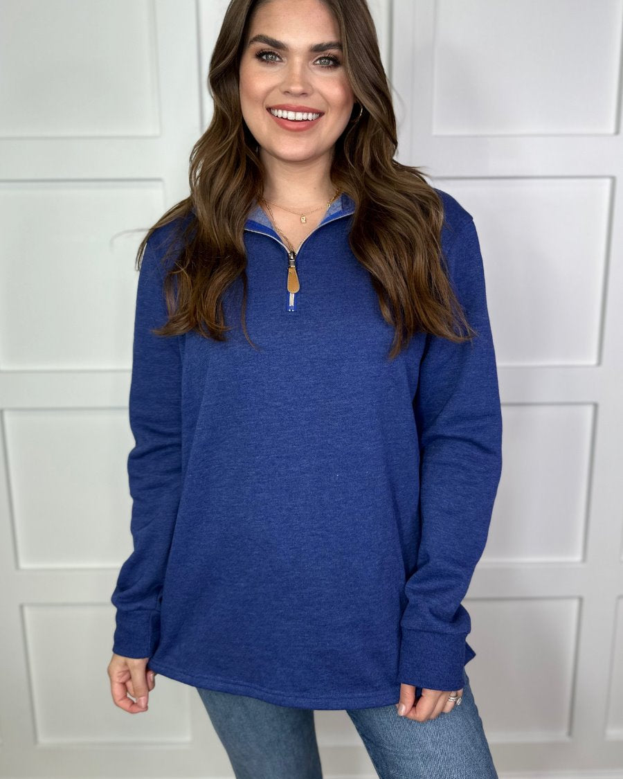 long sleeve pullover crafted from vintage wash fabric with a foldable collar, side slits, and a quarter zip in navy