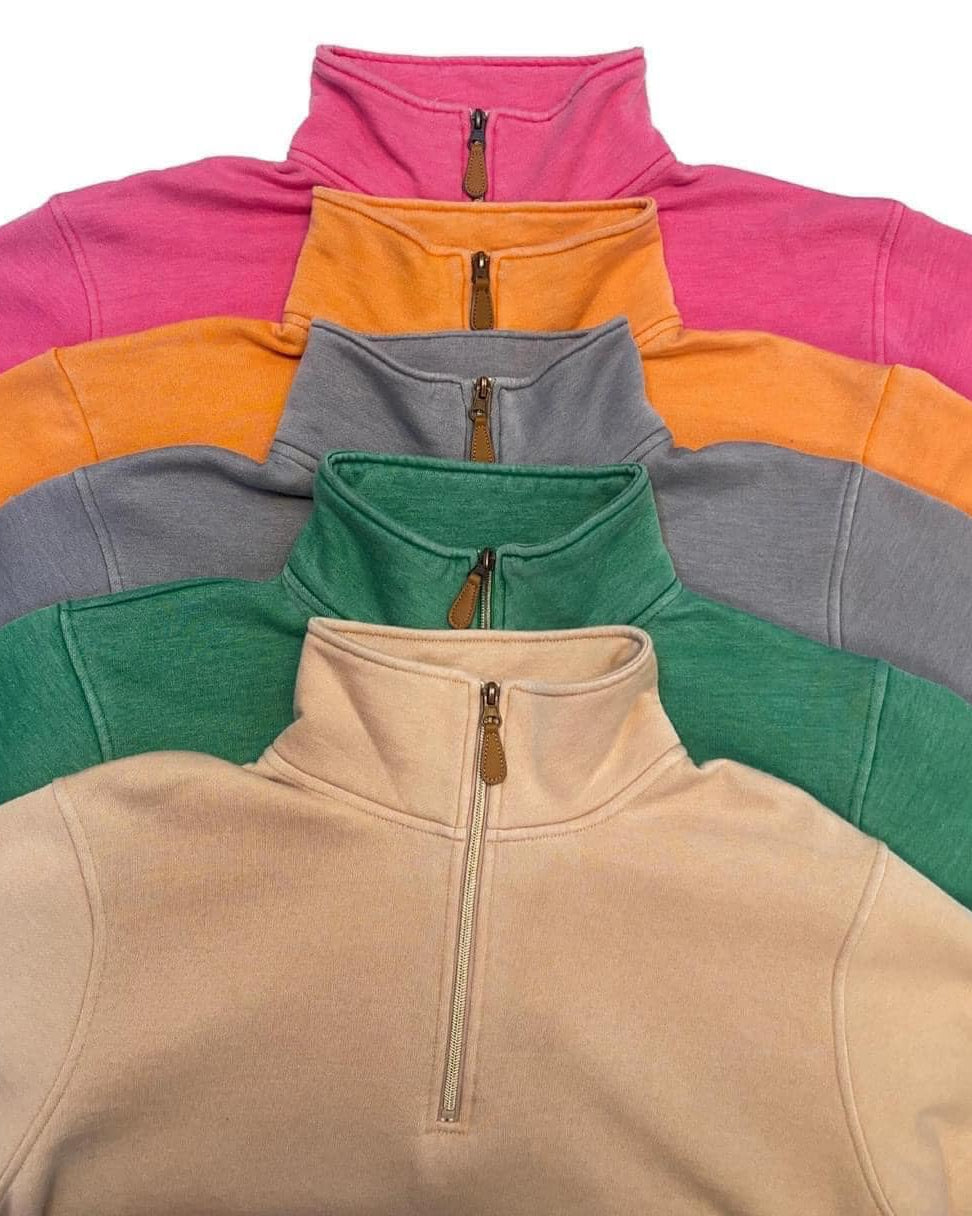 long sleeve pullover crafted from vintage wash fabric with a foldable collar, side slits, and a quarter zip in green, grey, orange, pink, and tan
