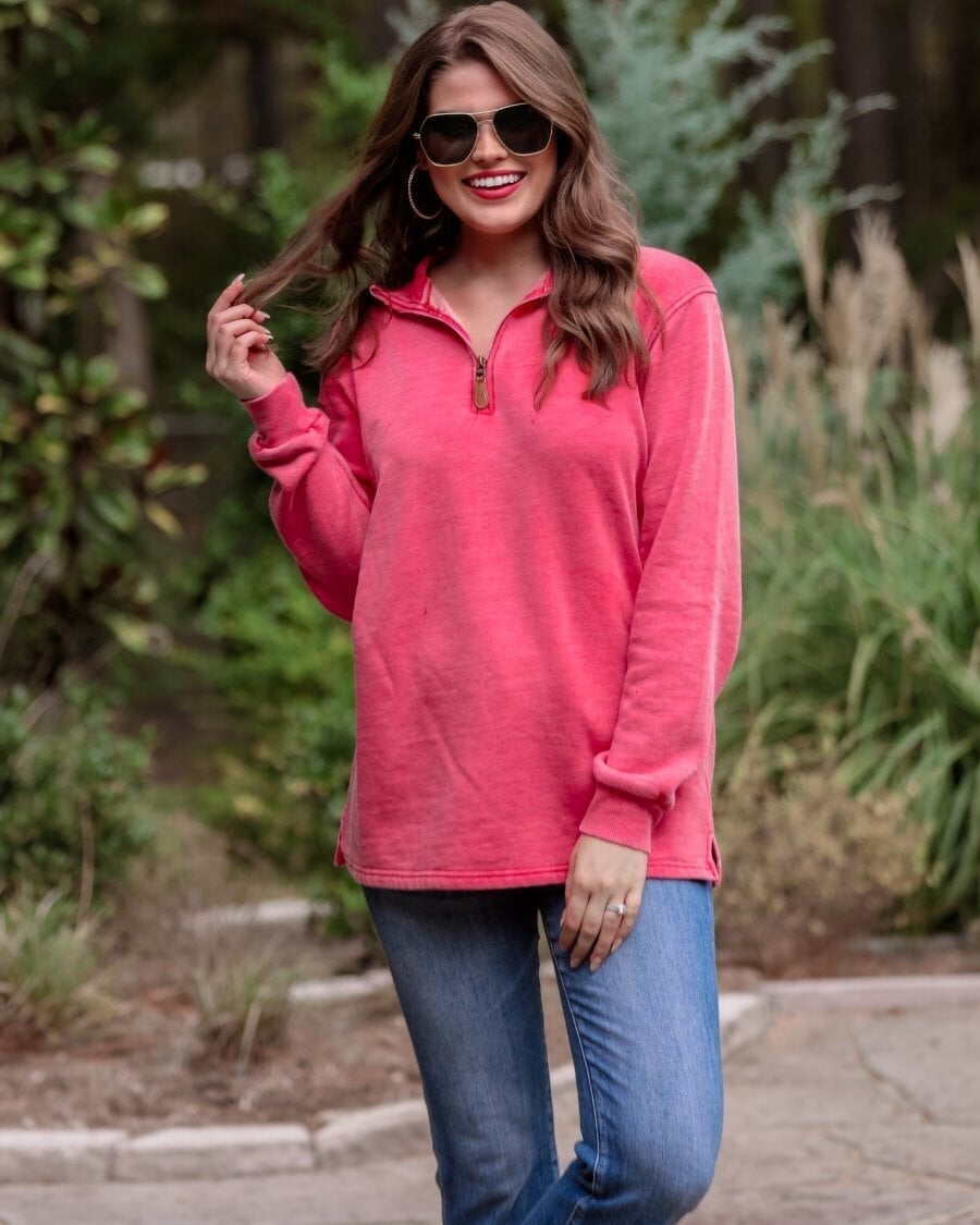 long sleeve pullover crafted from vintage wash fabric with a foldable collar, side slits, and a quarter zip in red