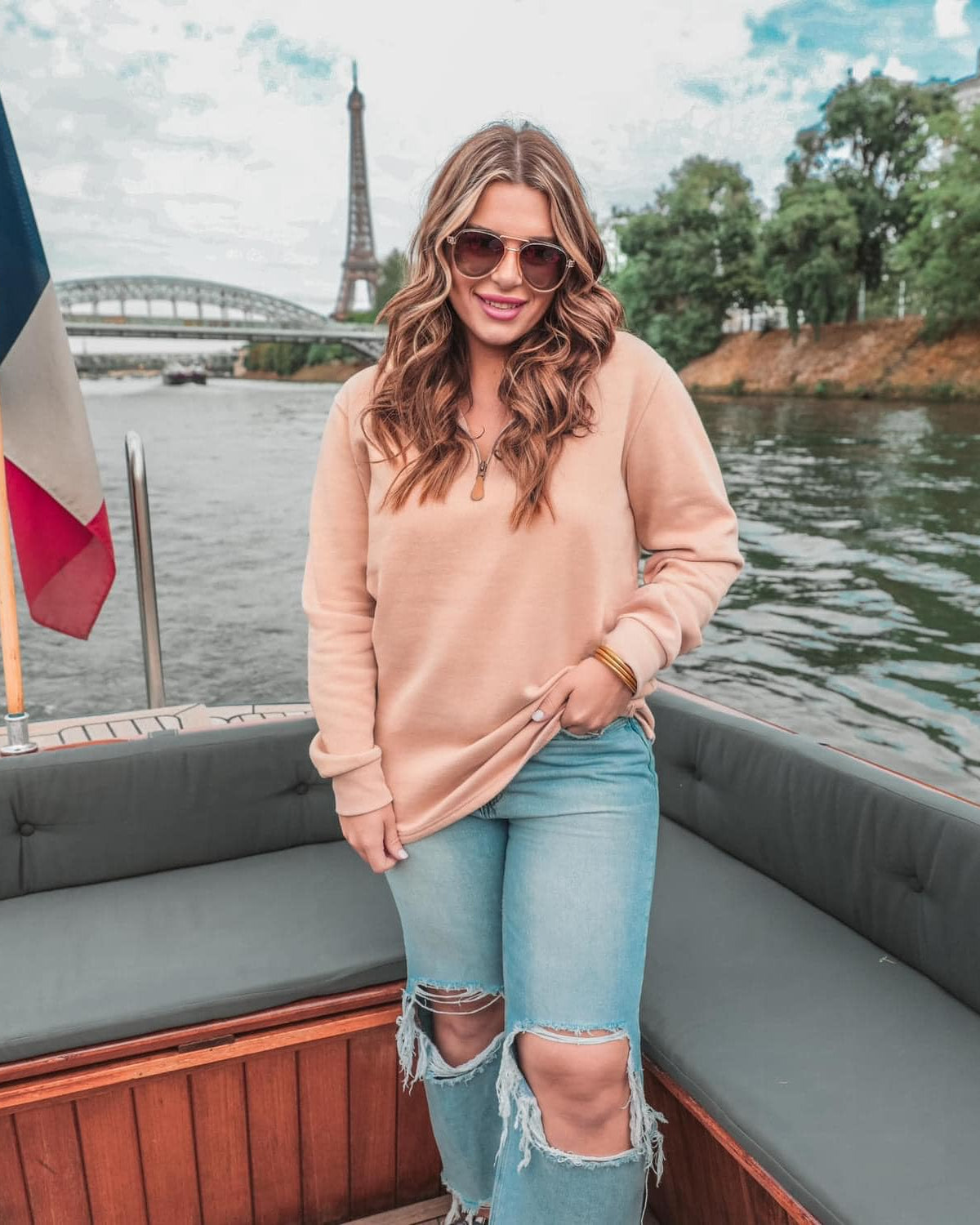 long sleeve pullover crafted from vintage wash fabric with a foldable collar, side slits, and a quarter zip in tan