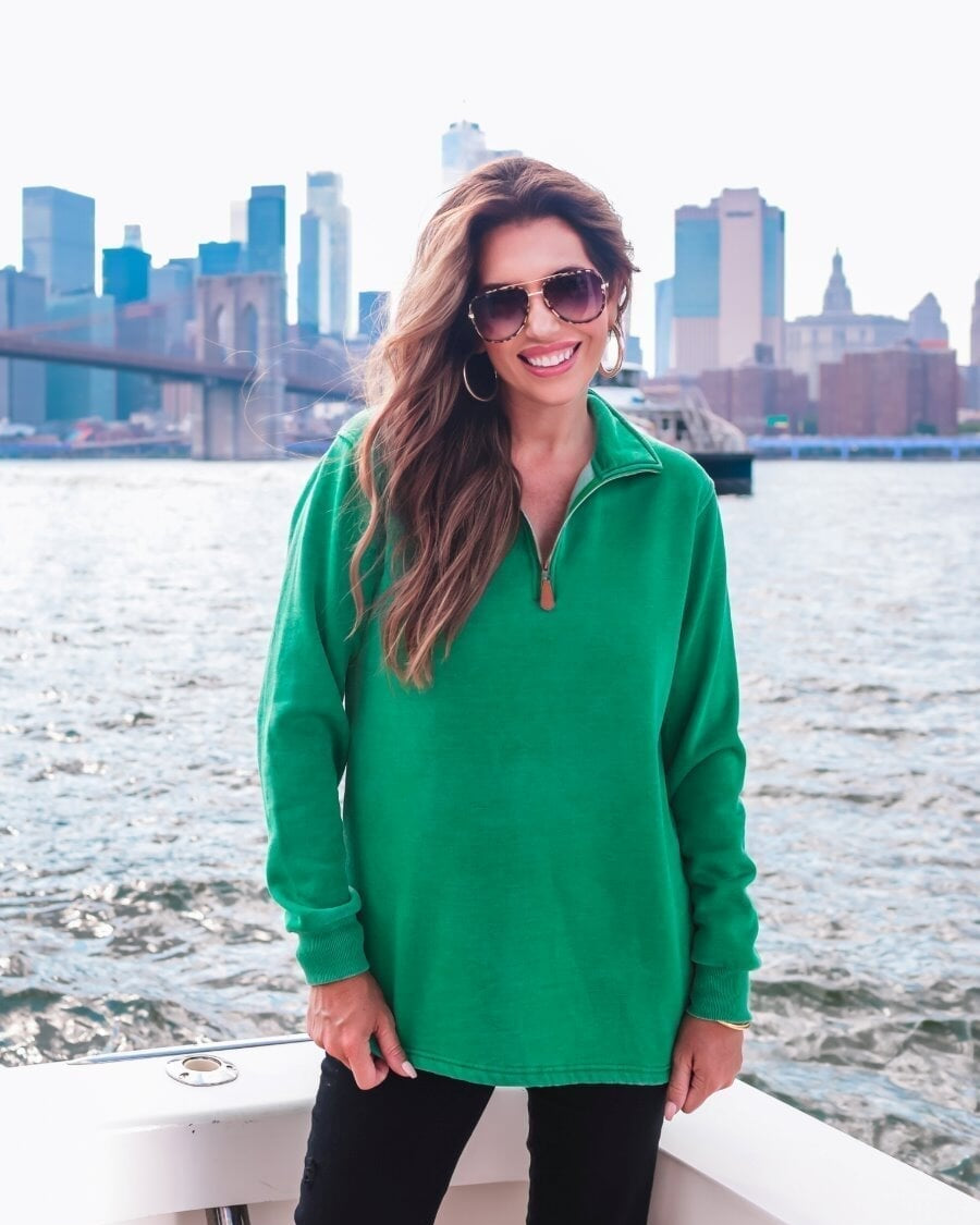 long sleeve pullover crafted from vintage wash fabric with a foldable collar, side slits, and a quarter zip in green