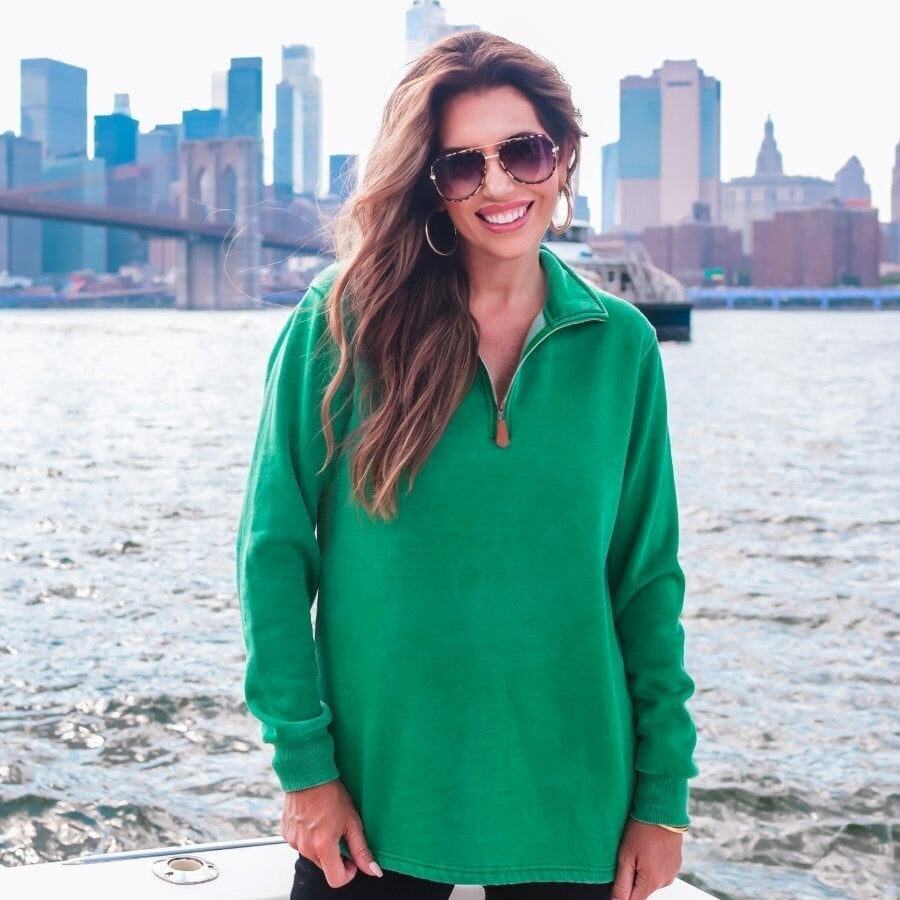 long sleeve pullover crafted from vintage wash fabric with a foldable collar, side slits, and a quarter zip in green