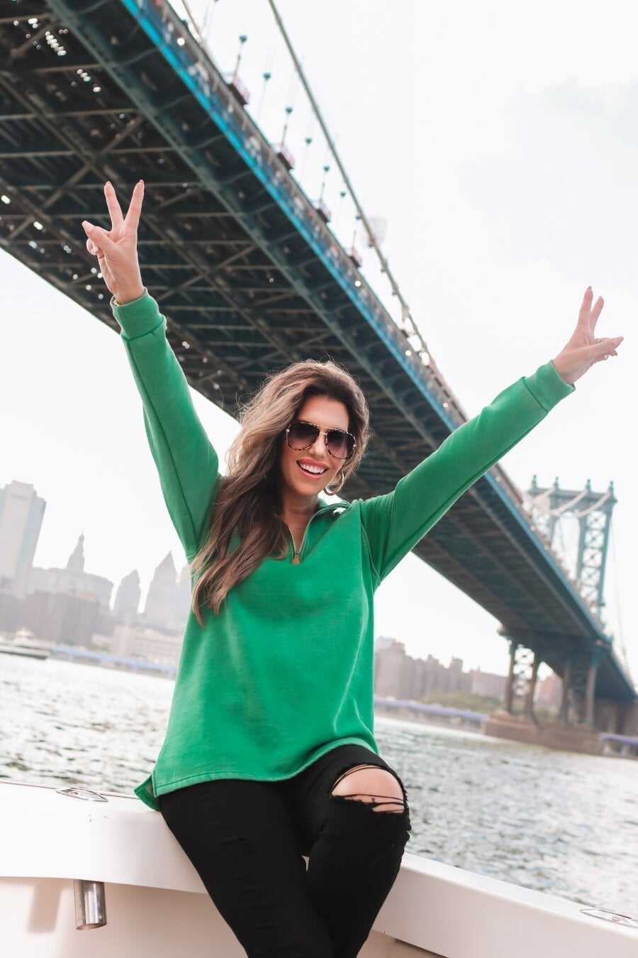 long sleeve pullover crafted from vintage wash fabric with a foldable collar, side slits, and a quarter zip in green