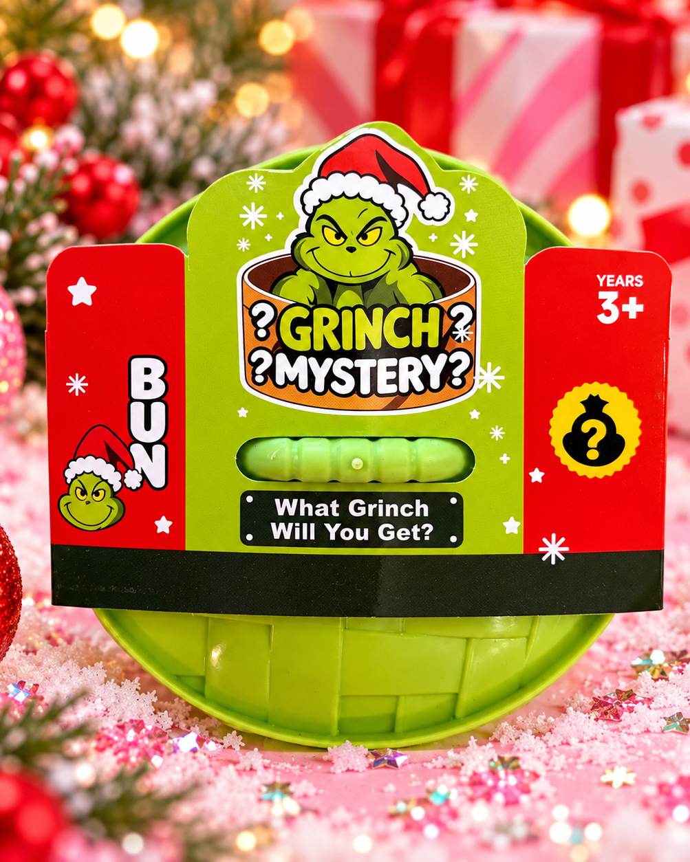 a lime green glitter-filled Grinch-inspired dumpling squishy with a soft, squeezable texture, rounded steamed-bun silhouette, mischievous facial design, and coordinating steamer-style container