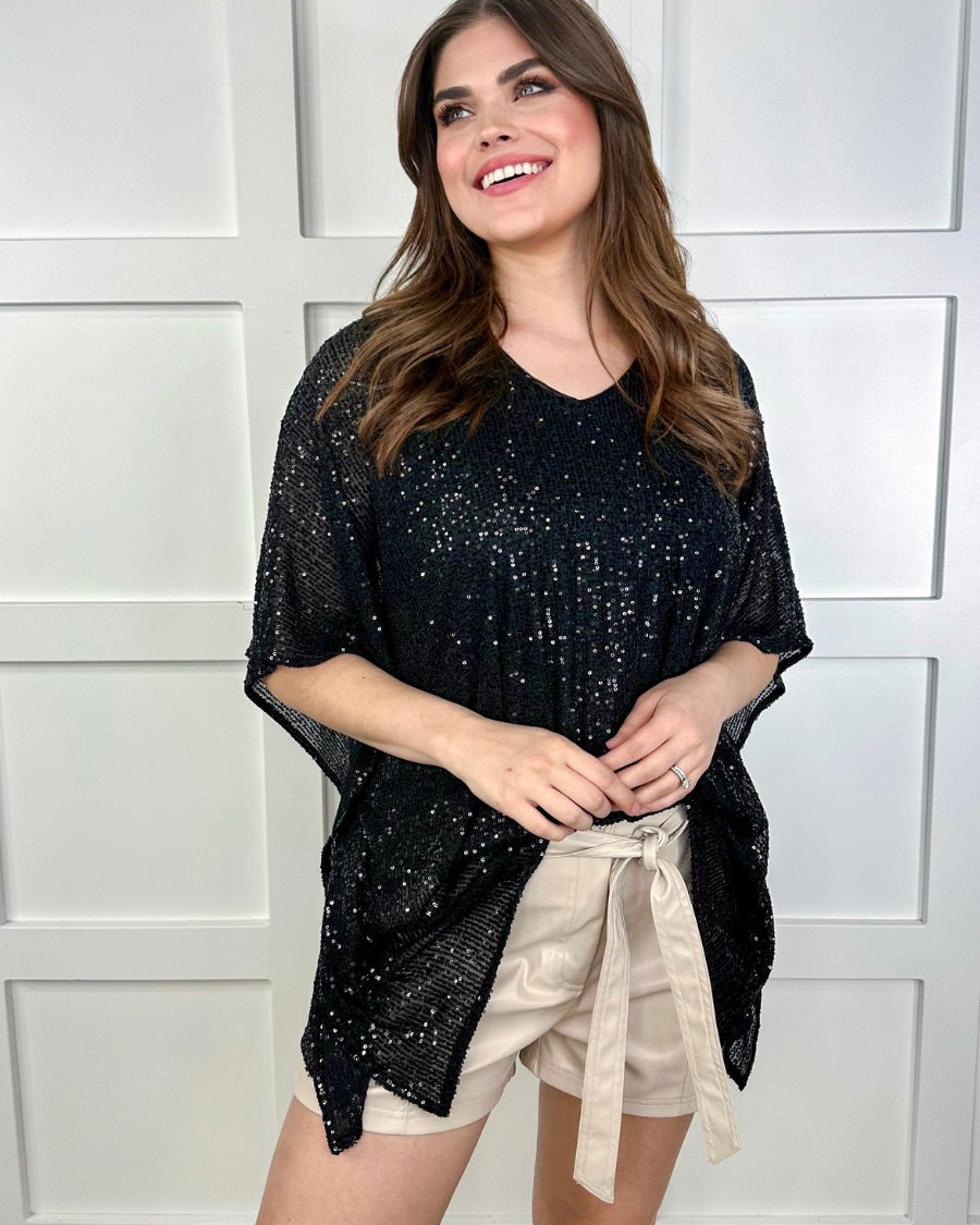 sleek faux leather shorts with zip and button closure, side pockets, a non-removable tie detail, and an elastic back waistband in taupe