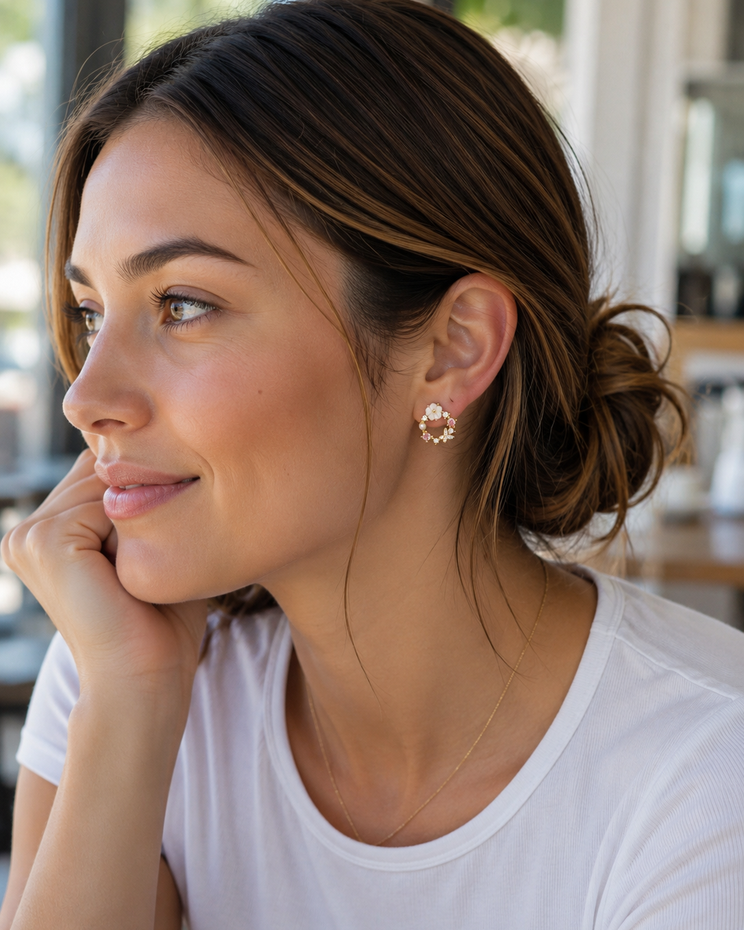 gold-plated mini hoop post-stud earrings with a petite circular silhouette, butterfly cubic zirconia stones in soft pastel shades, crystal accents, a pearl detail, floral embellishments, and gold comfort backs