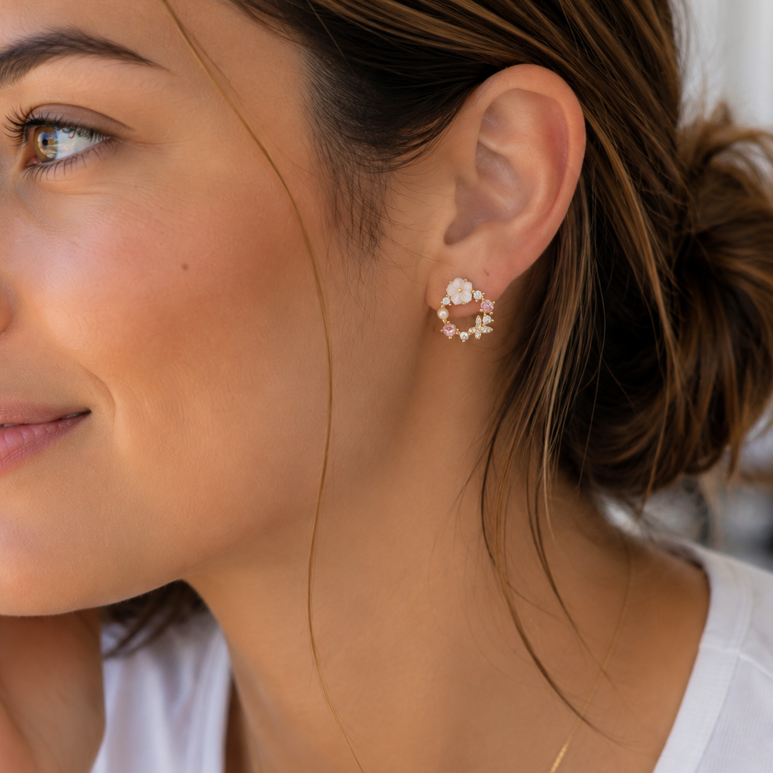 gold-plated mini hoop post-stud earrings with a petite circular silhouette, butterfly cubic zirconia stones in soft pastel shades, crystal accents, a pearl detail, floral embellishments, and gold comfort backs