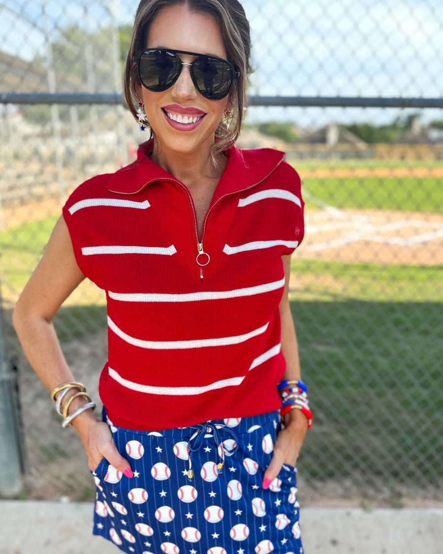 mid-relaxed fit everyday skort made of lightweight material with built-in ivory shorts, drawstring tie, an elastic band on the back, and side pockets, designed on a baseball pattern print and royal blue base