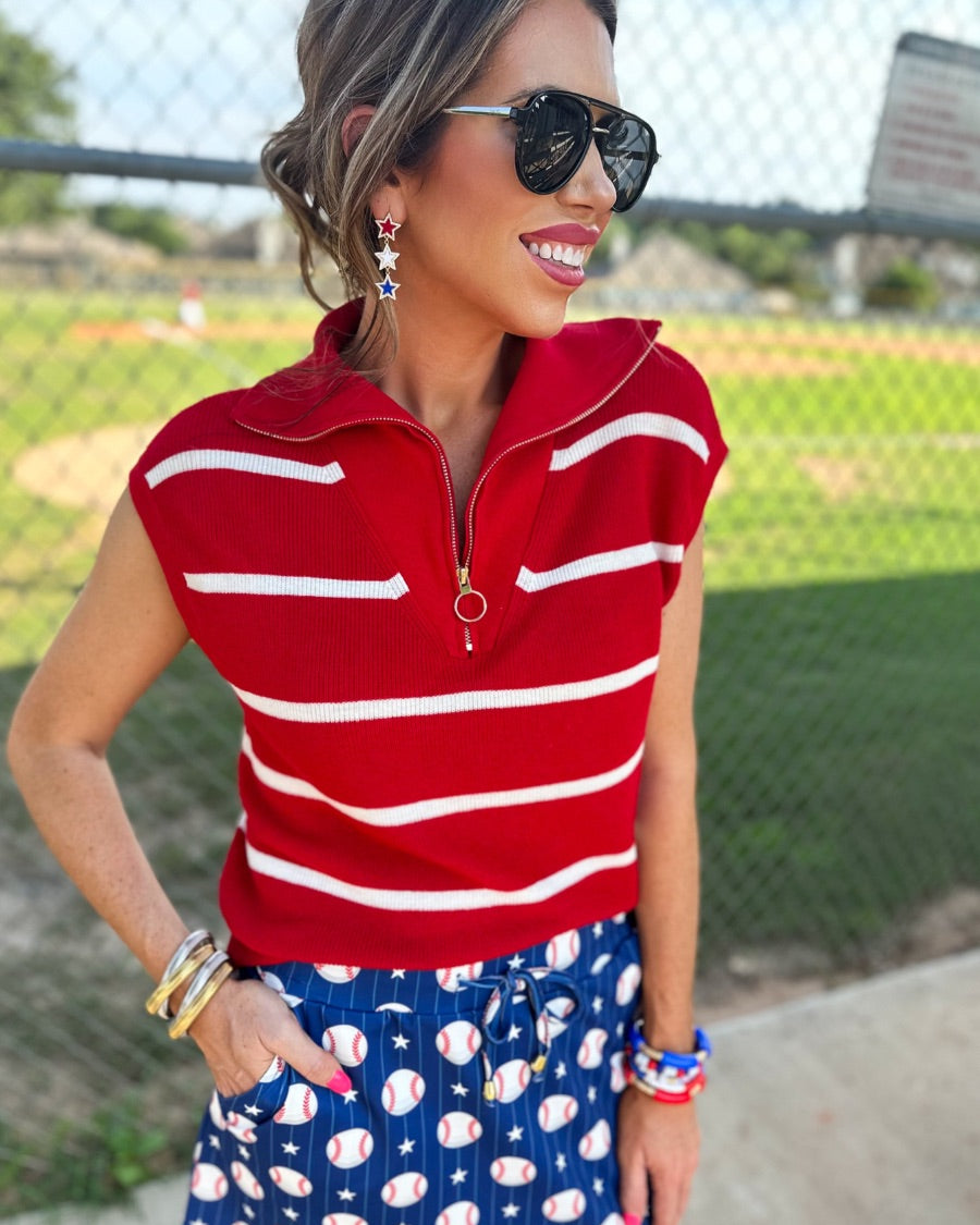 mid-relaxed fit everyday skort made of lightweight material with built-in ivory shorts, drawstring tie, an elastic band on the back, and side pockets, designed on a baseball pattern print and royal blue base