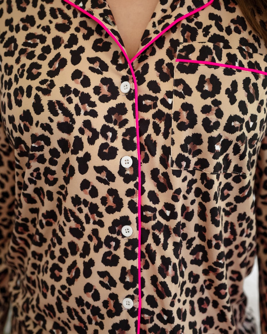 long sleeve top and matching shorts on a brown leopard fabric with hot pink accents