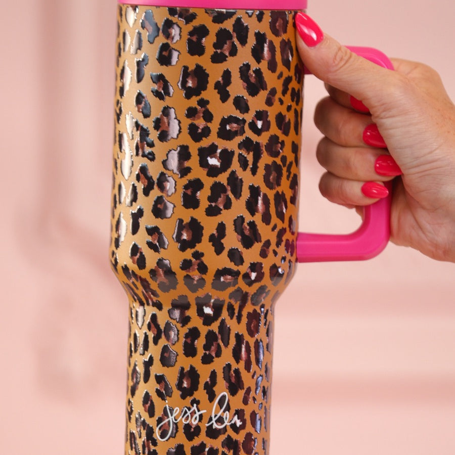 40-ounce tumbler with a hot pink and leopard print design, handle, screw-on lid, and a reusable straw